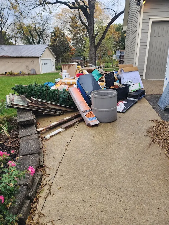 Dumpster being loaded with debris for 30 Yard Dumpster Rental in San Dimas